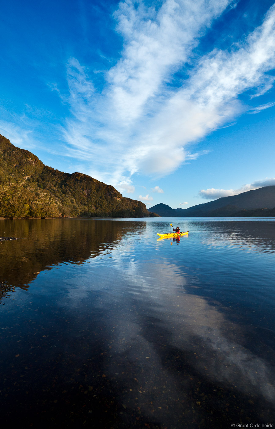 A sea kayaker on the still waters of Isla Kent.