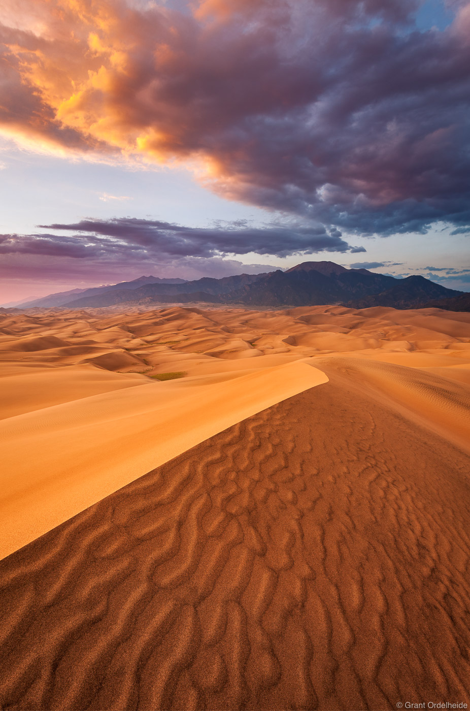 Sunset erupts over North America's largest sand dunes near Alamosa, Colorado.