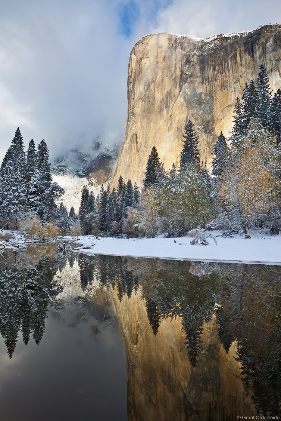 El Capitan reflected in the Merced river after a fall snowstorm.