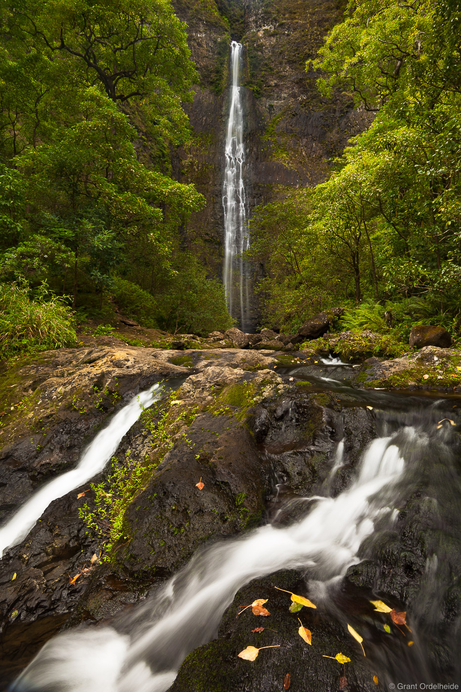 The beautiful Hanakapi'ai waterfall along the Na Pali Coast in Kauai.