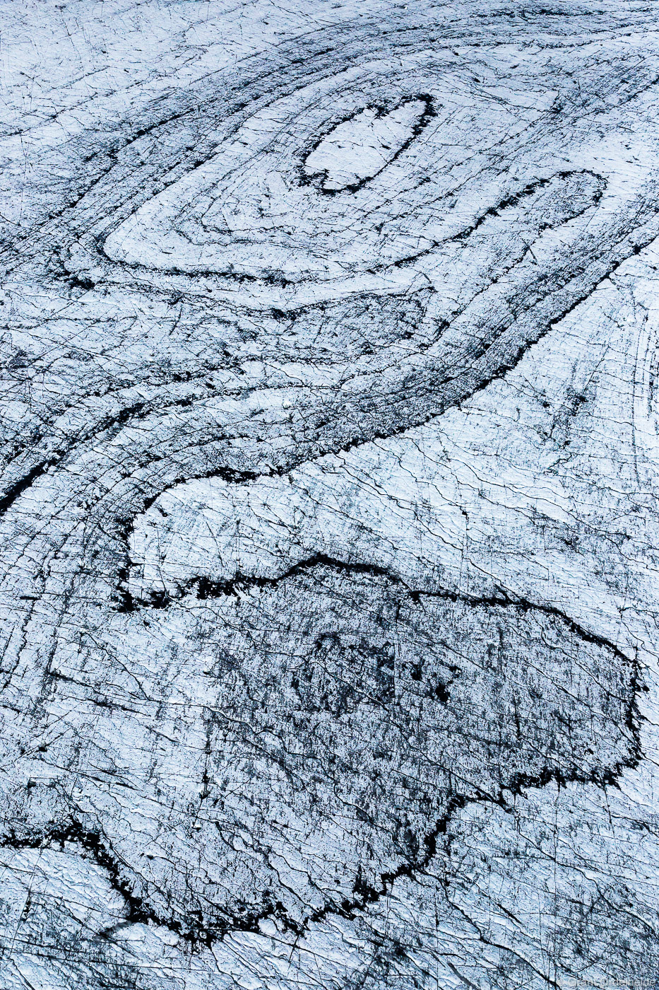 Aerial image of abstract lines and patterns in the Vatnajökull glacier in Iceland.