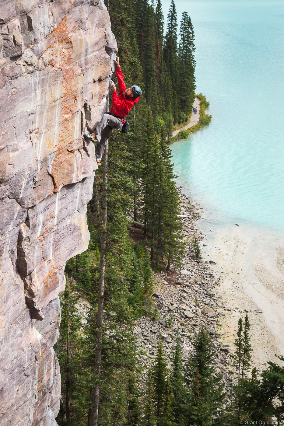 A climber ascends a route on the Back of the Lake crag at Alberta's Lake Louise.