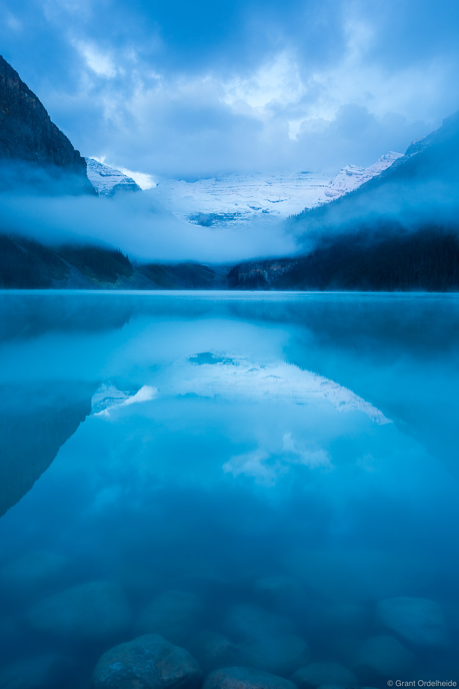 A foggy morning at the iconic Lake Louise in Alberta, Canada.