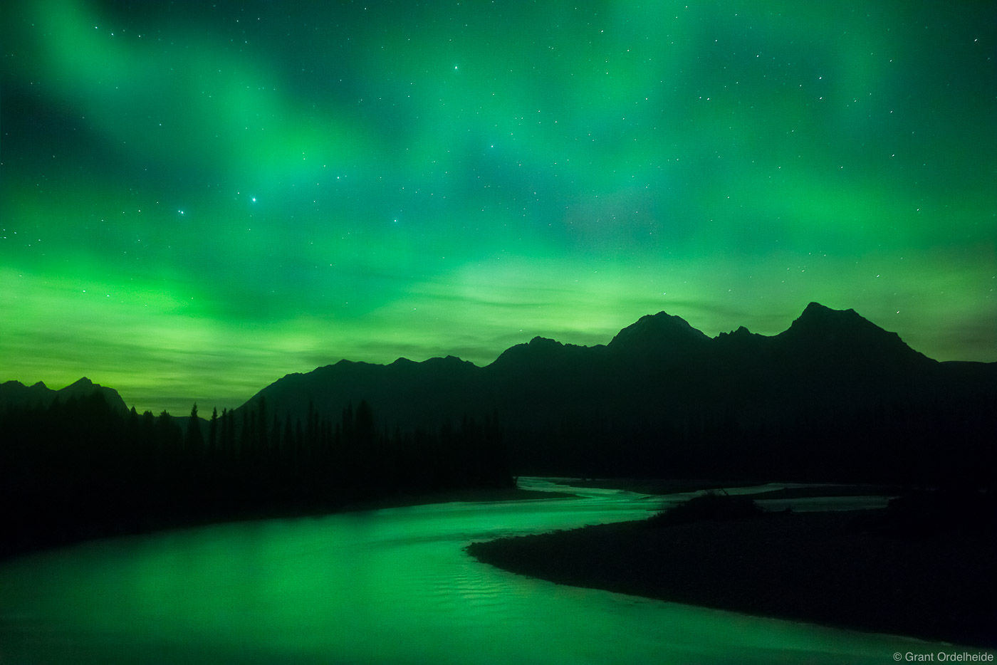 Aurora borealis&nbsp;over a snaking river in Kootenay National Park in the Canadian Rockies.
