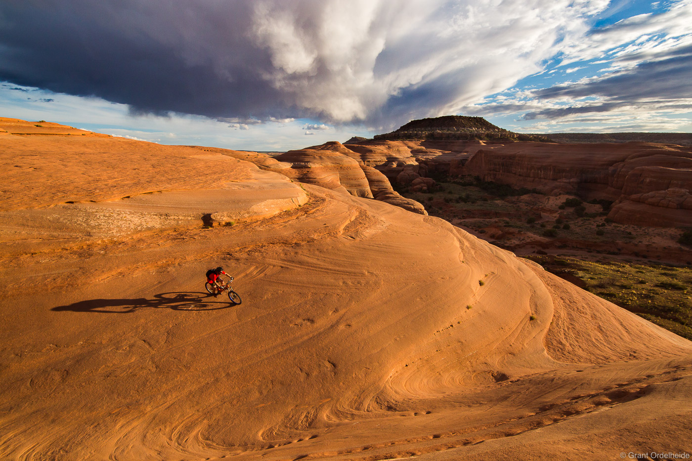 A mountain biker riding the slickrock at Bartlett Wash near Moab Utah.