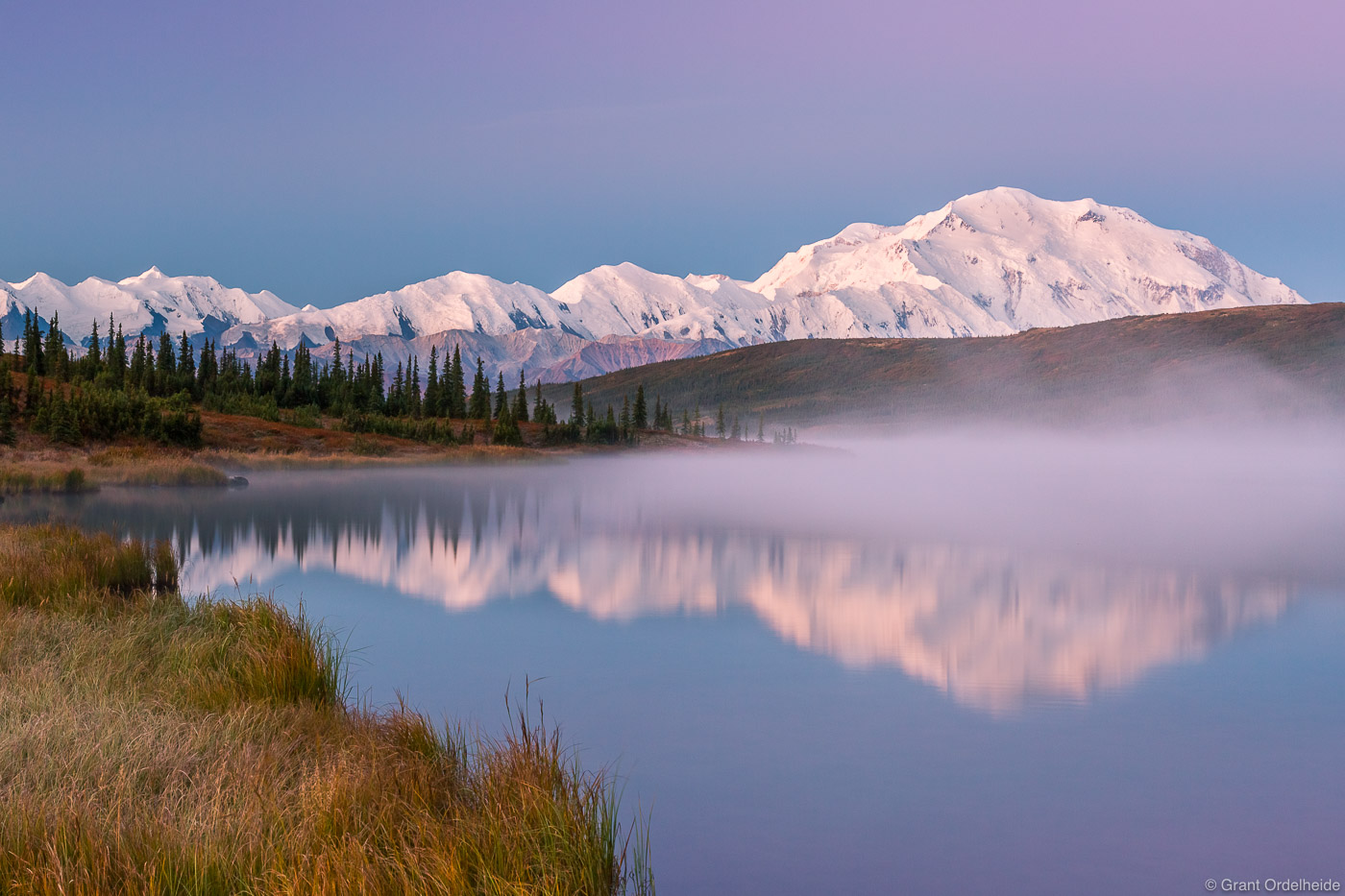 Mist rises off of Wonder Lake at dawn in Denali National Park.&nbsp;