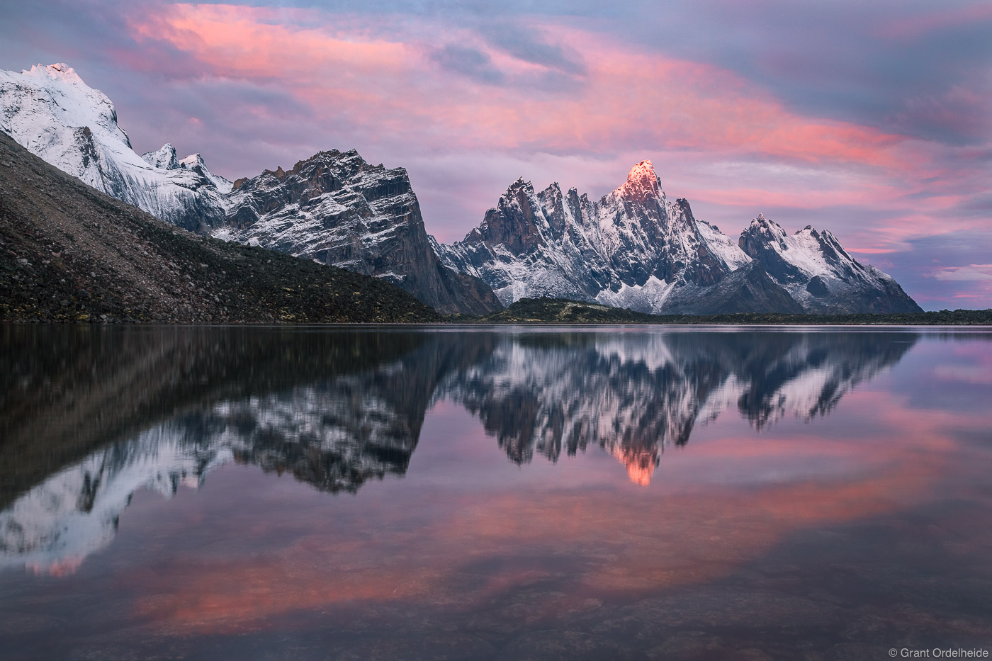 Sunrise over the freshly snow covered peak of Tombstone Mountain&nbsp;in&nbsp;Tombstone Territorial Park.