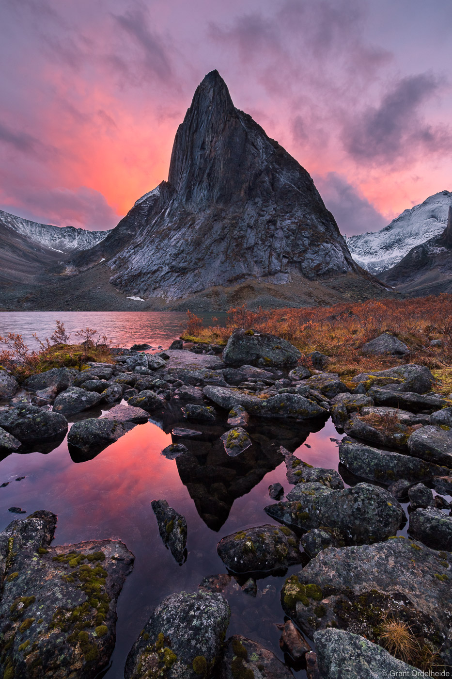 Autumn sunset over a rugged and remote mountain in Tombstone Territorial Park.