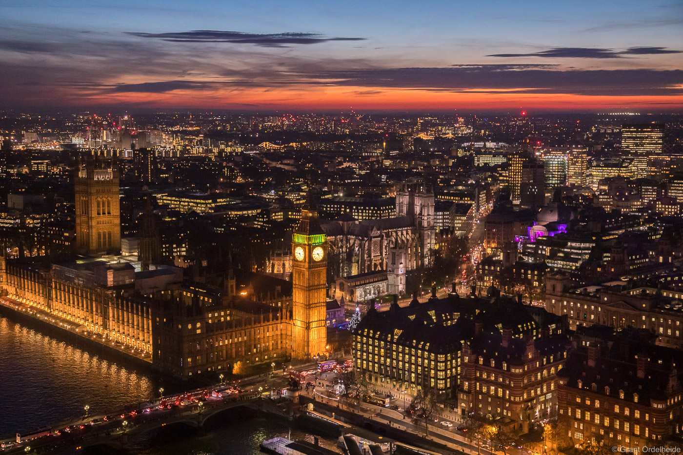 Parliament and Westminster Abbey at dusk viewed from the London Eye in the heart of London, England.