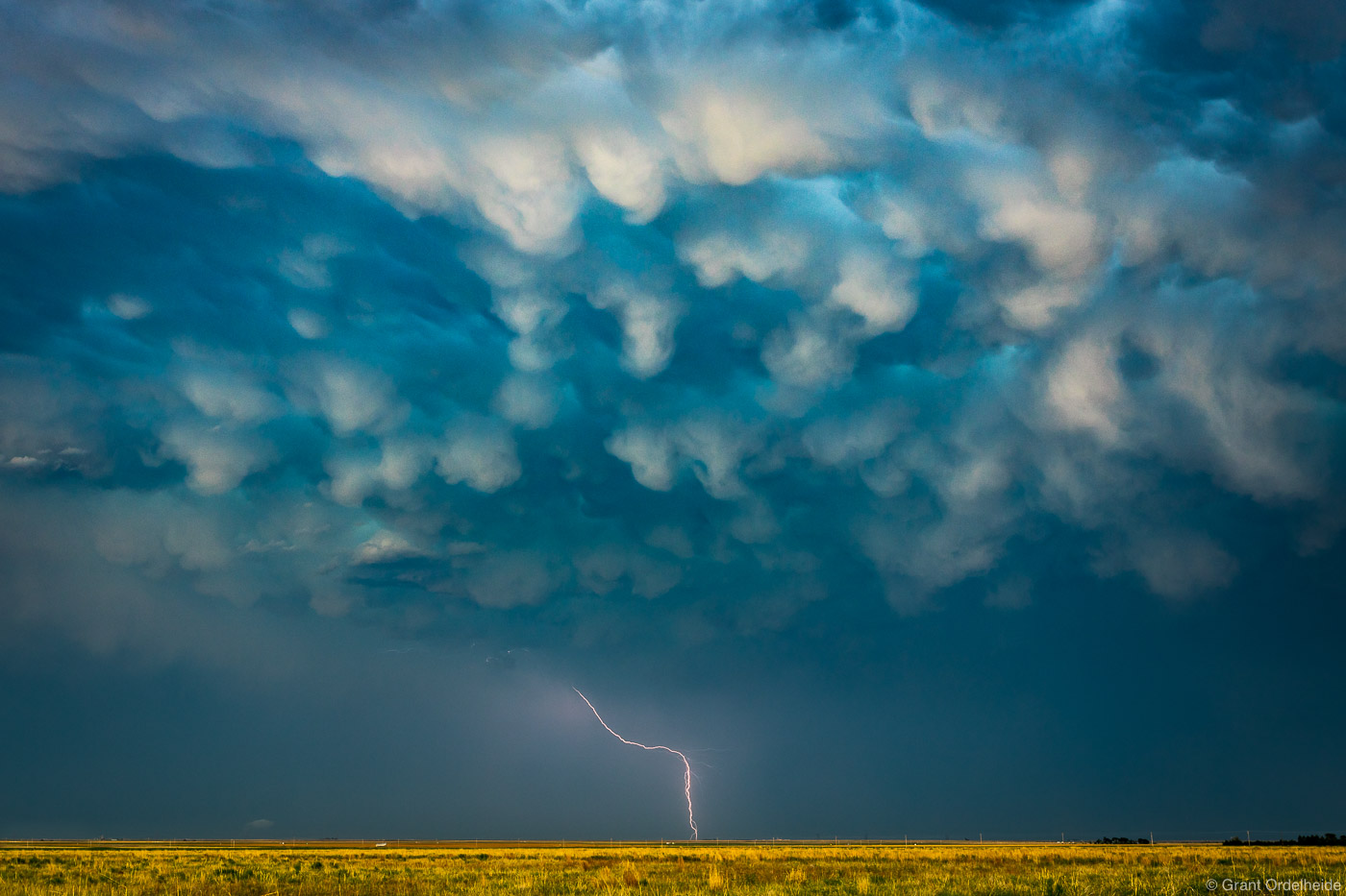 A lightning bolt and storm over rural Kansas.