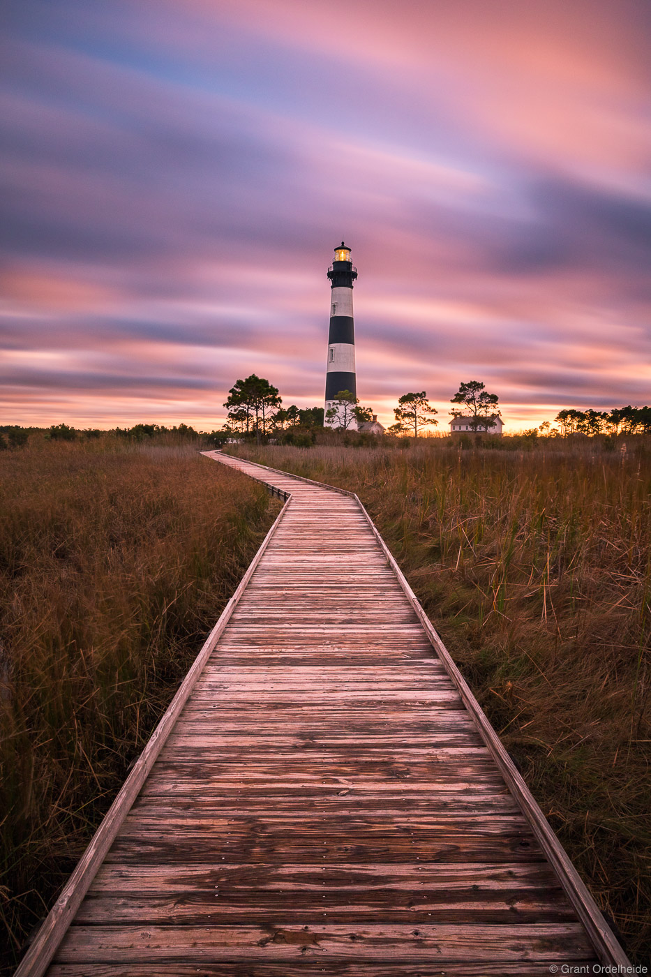 A stormy sunset over the historic Bodie Island Lighthouse on North Carolina's Outer Banks.