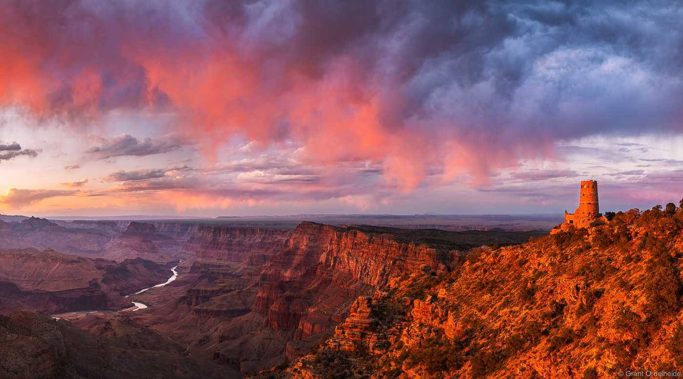 A pink sunset over the Desert View Watchtower on the South Rim of the Grand Canyon.