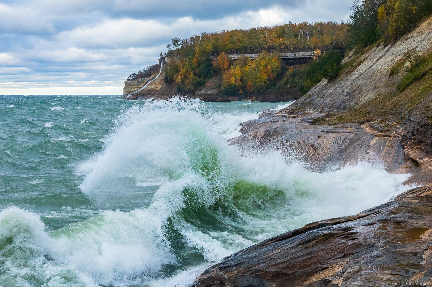 A wave crashing on the sandstone cliffs of Pictured Rocks National Lakeshore near Munising, Michigan.