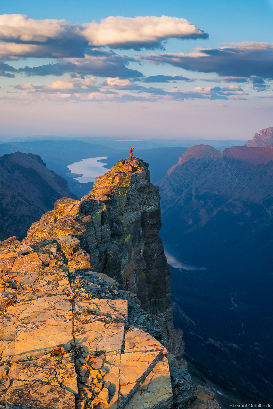A hiker on the summit of a small unnamed peak deep in Glacier National Park.
