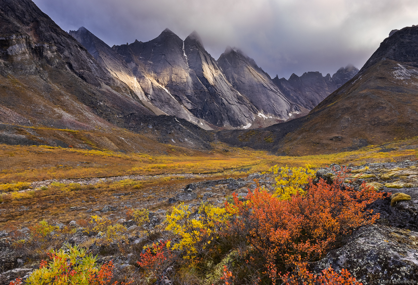 Fall colored tundra below the iconic Maidens in Alaska's Gates of the Arctic National Park.