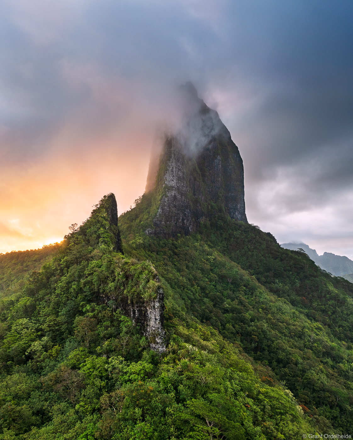 A stormy sunset over the rugged peaks of the island of Moorea.