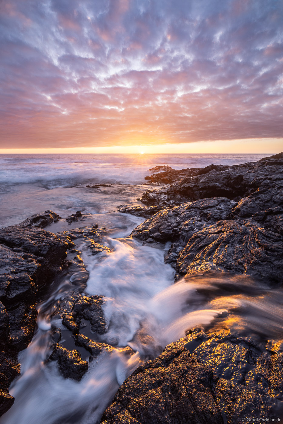 A beautiful sunset along the lava coastline of the Big Island