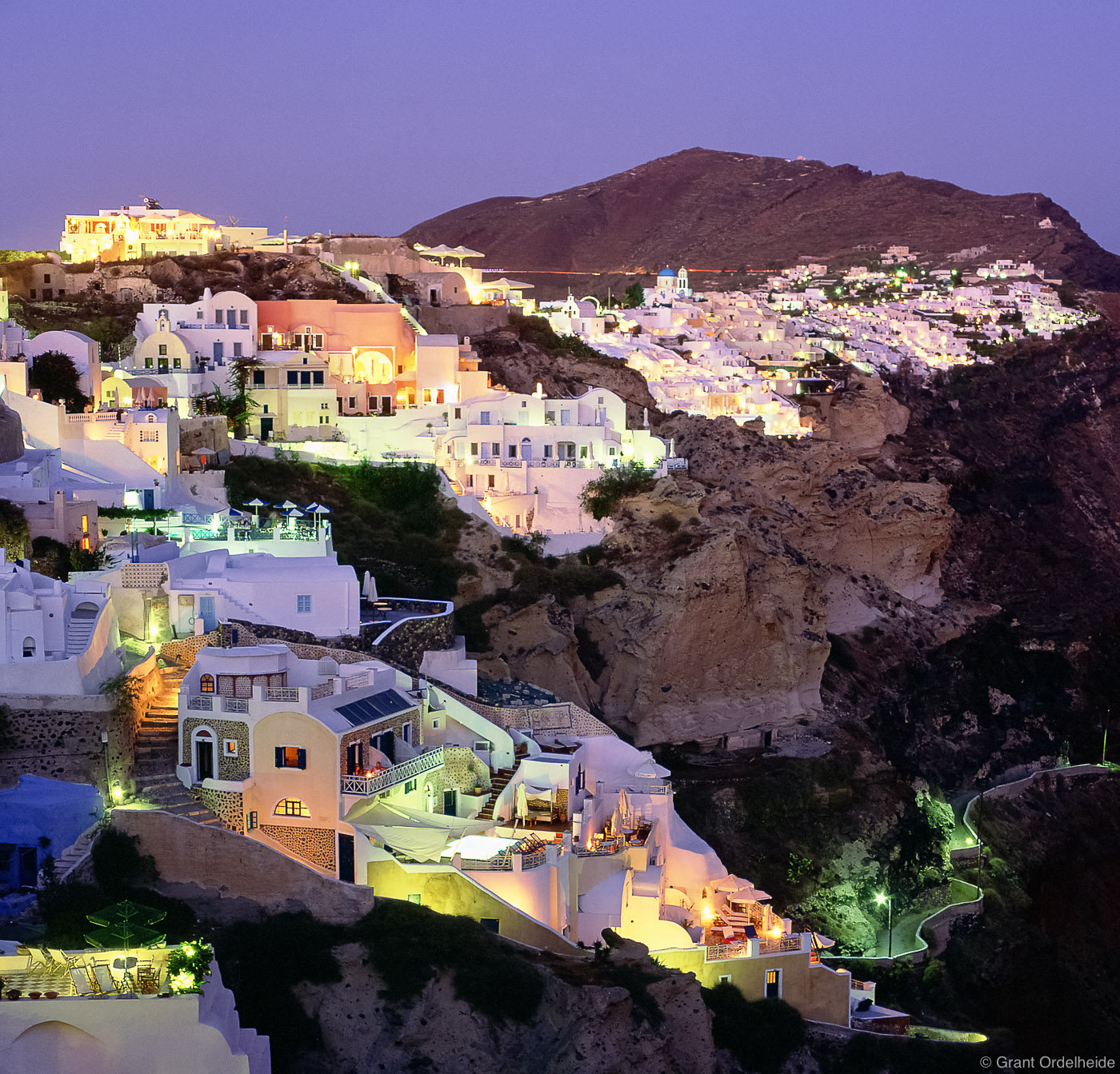 Night descends onto the seaside village of Oia on Santorini.