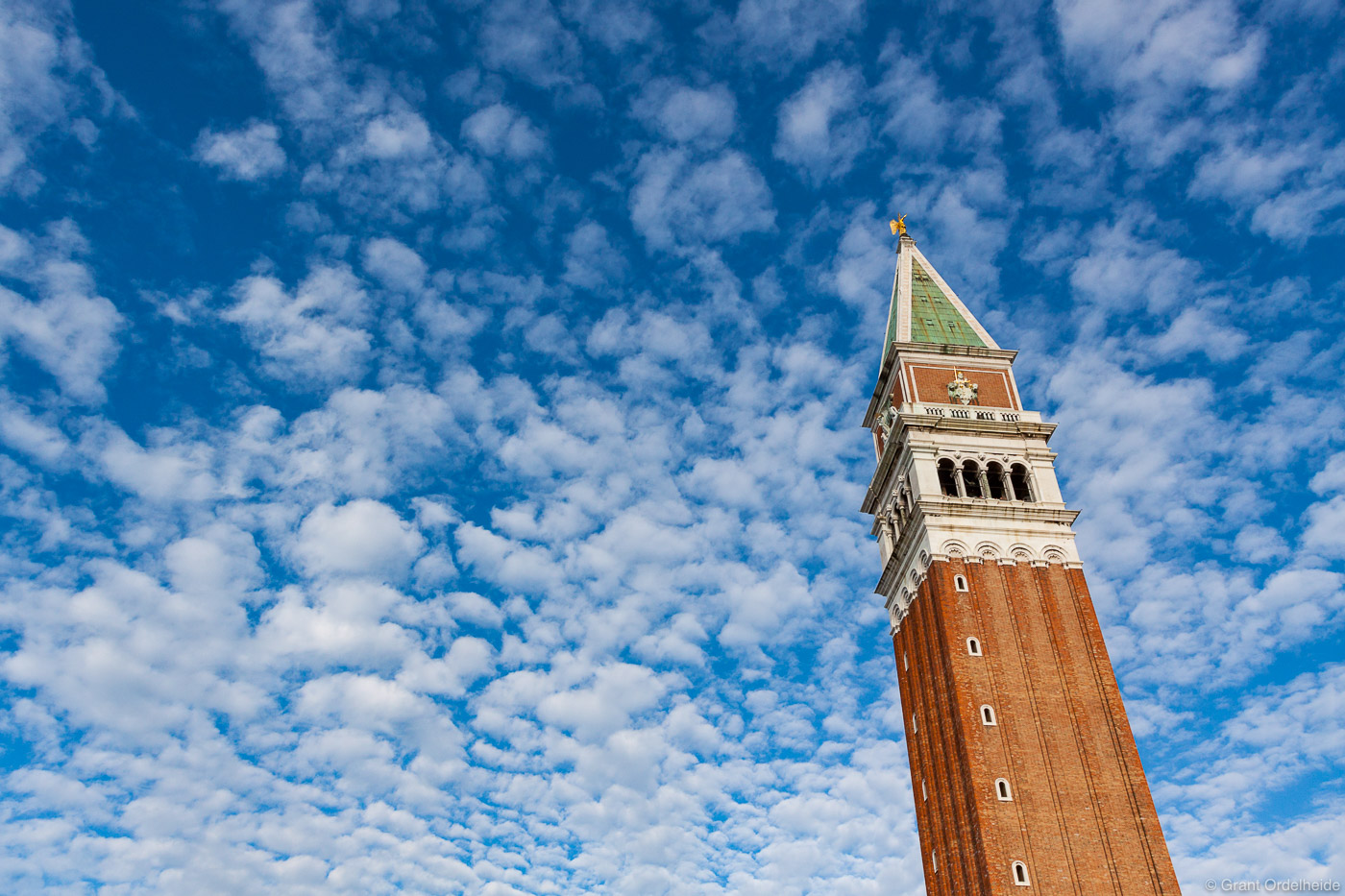 Clouds above the tower in St. Marks square in Venice Italy.