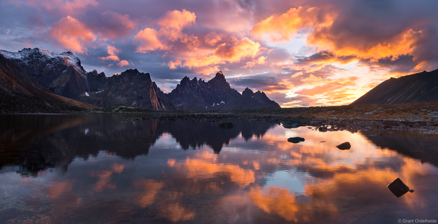 A clearing storm at sunset over Talus Lake and Tombstone Mountain in Tombstone Territorial Park.